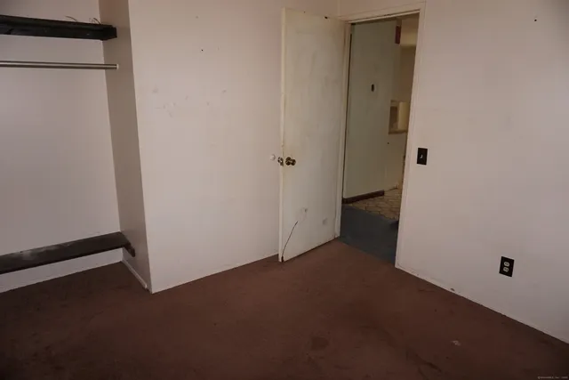 a view of a refrigerator in kitchen