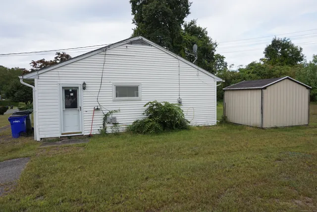 a view of a backyard of the house