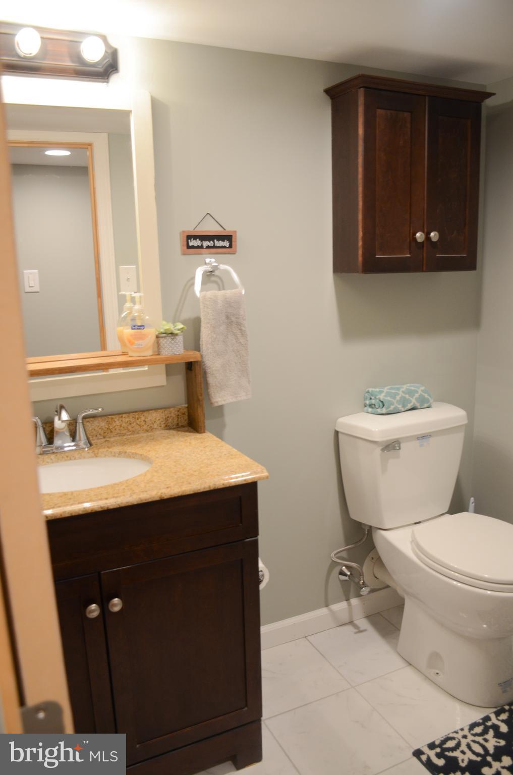 4 Norman Avenue Delran, NJ 08075 - Photo 24 of 30 a bathroom with a sink a toilet and mirror
