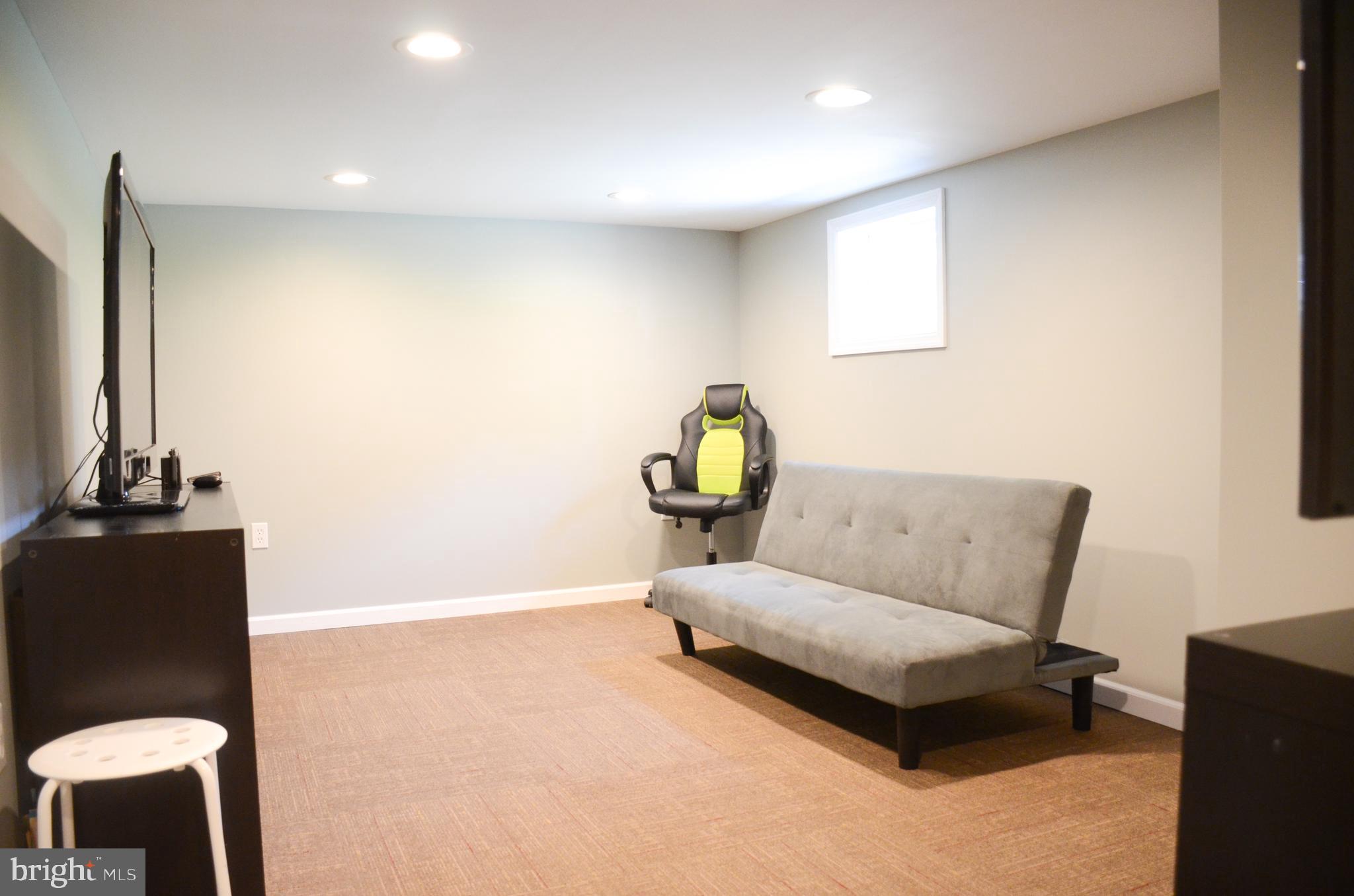 4 Norman Avenue Delran, NJ 08075 - Photo 25 of 30 a living room with furniture and a lamp
