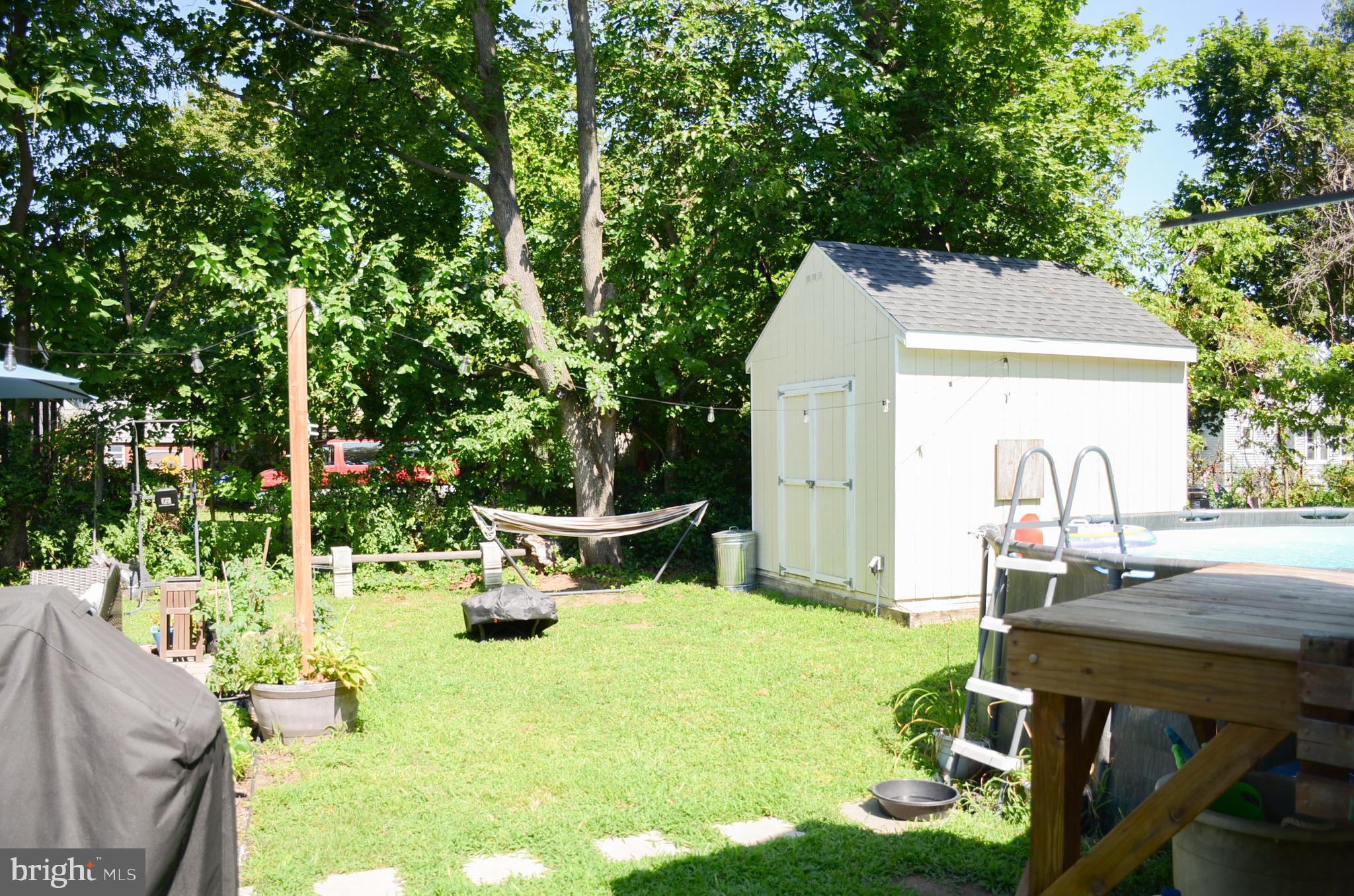 4 Norman Avenue Delran, NJ 08075 - Photo 28 of 30 a view of backyard with a table and chairs