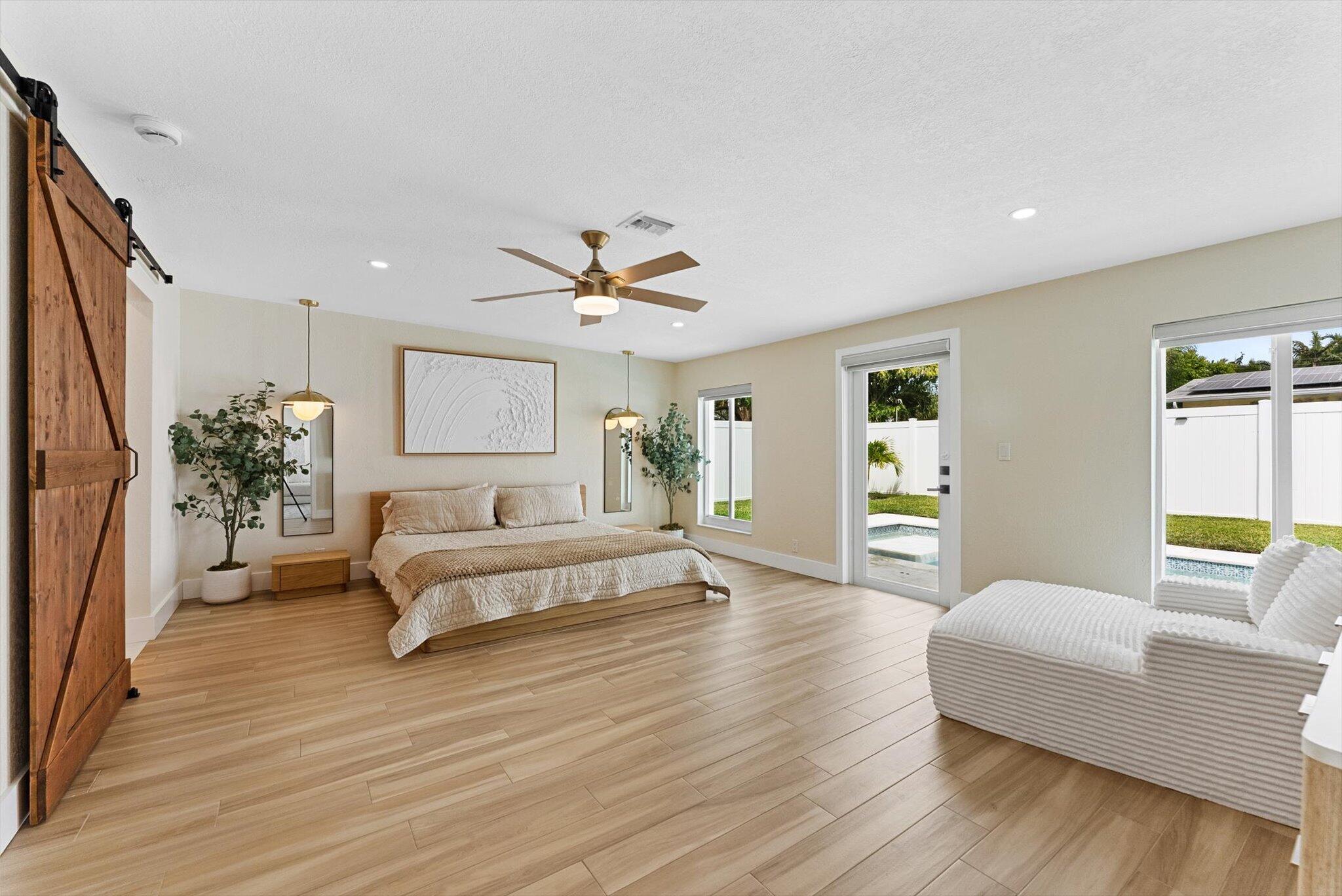 1289 Southwest 7th Street Boca Raton, FL 33486 - Photo 17 of 42 a living room with furniture and a large window