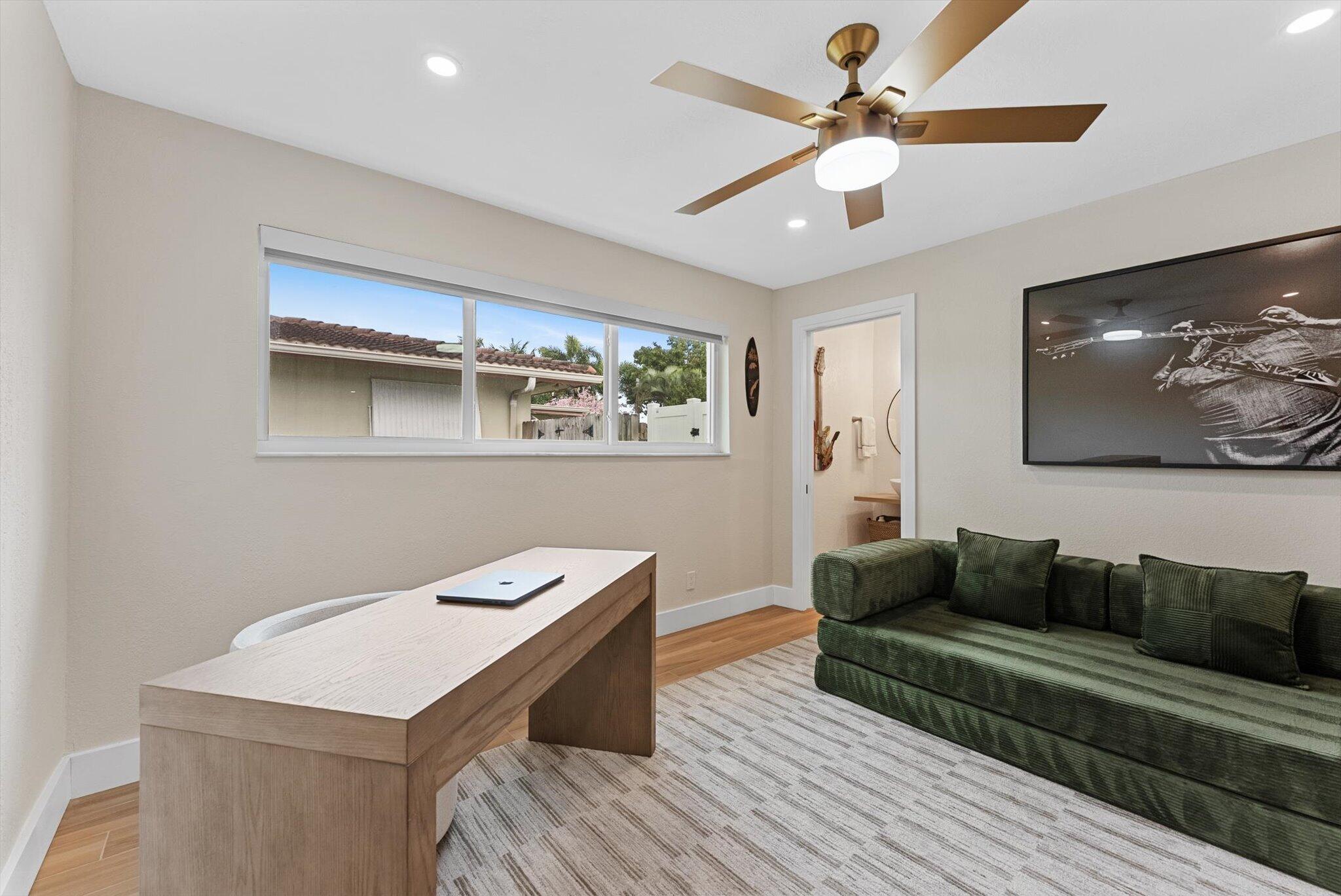 1289 Southwest 7th Street Boca Raton, FL 33486 - Photo 24 of 42 a living room with furniture and a flat screen tv
