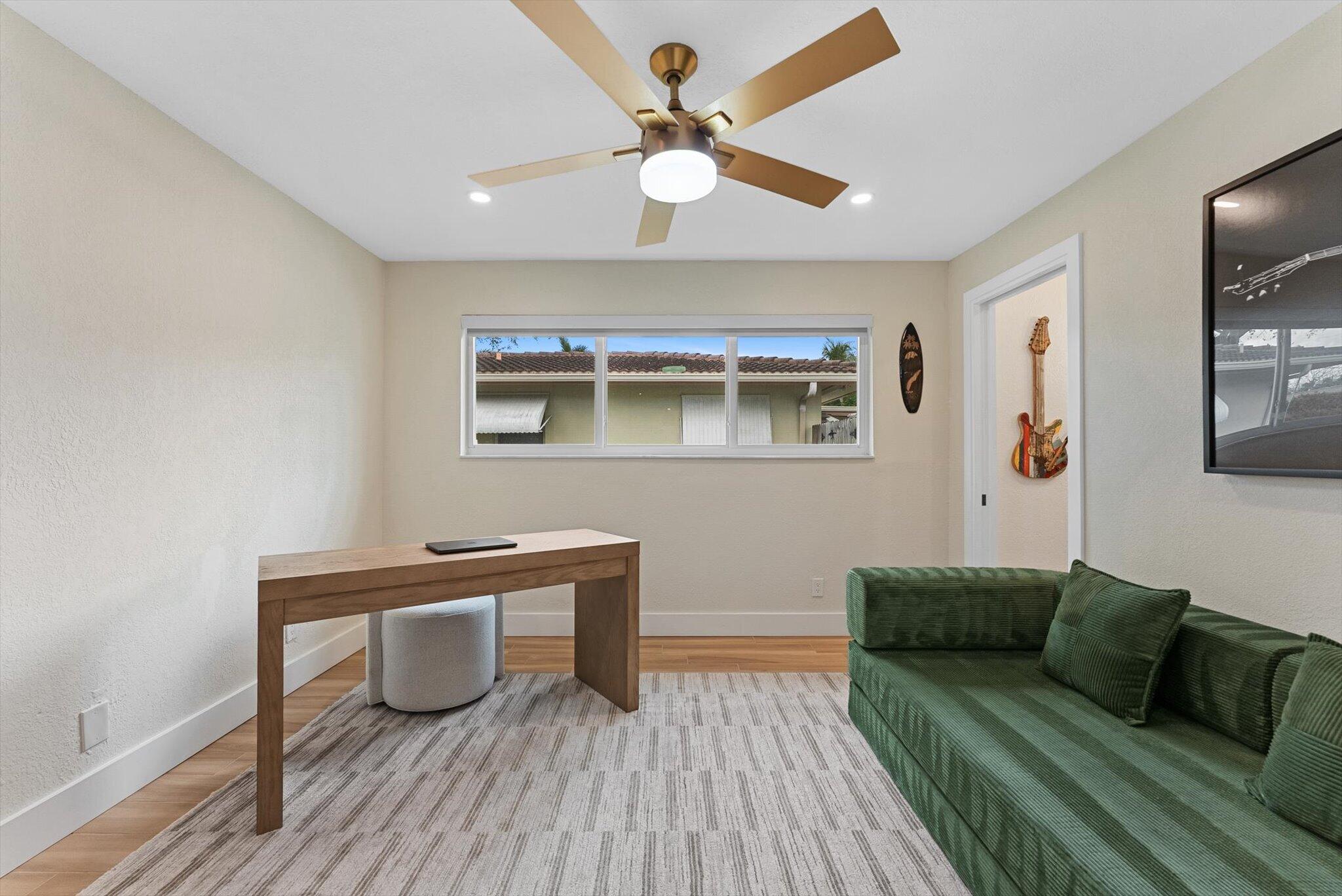 1289 Southwest 7th Street Boca Raton, FL 33486 - Photo 25 of 42 a living room with furniture and a wooden floor