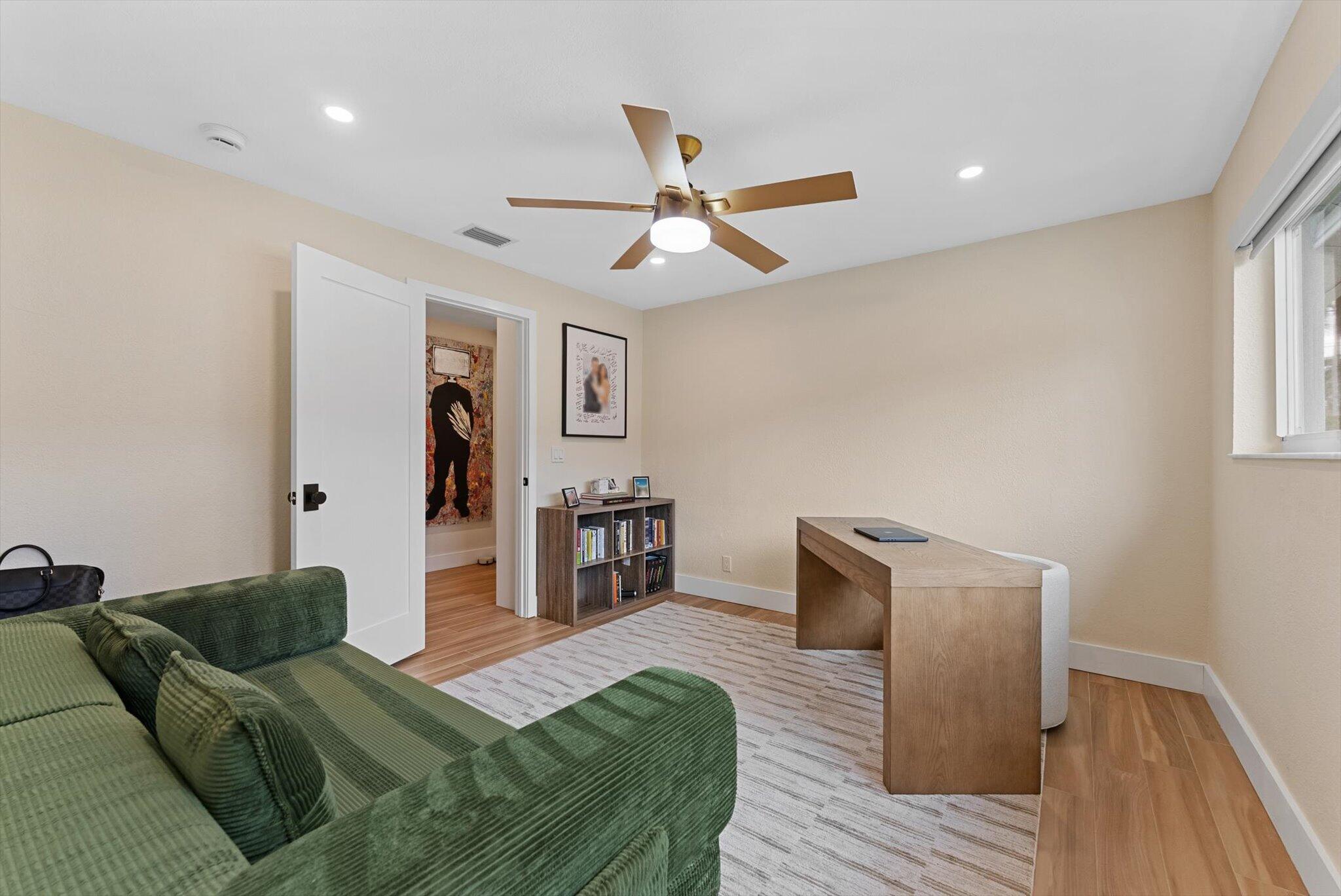 1289 Southwest 7th Street Boca Raton, FL 33486 - Photo 26 of 42 a living room with furniture and a wooden floor