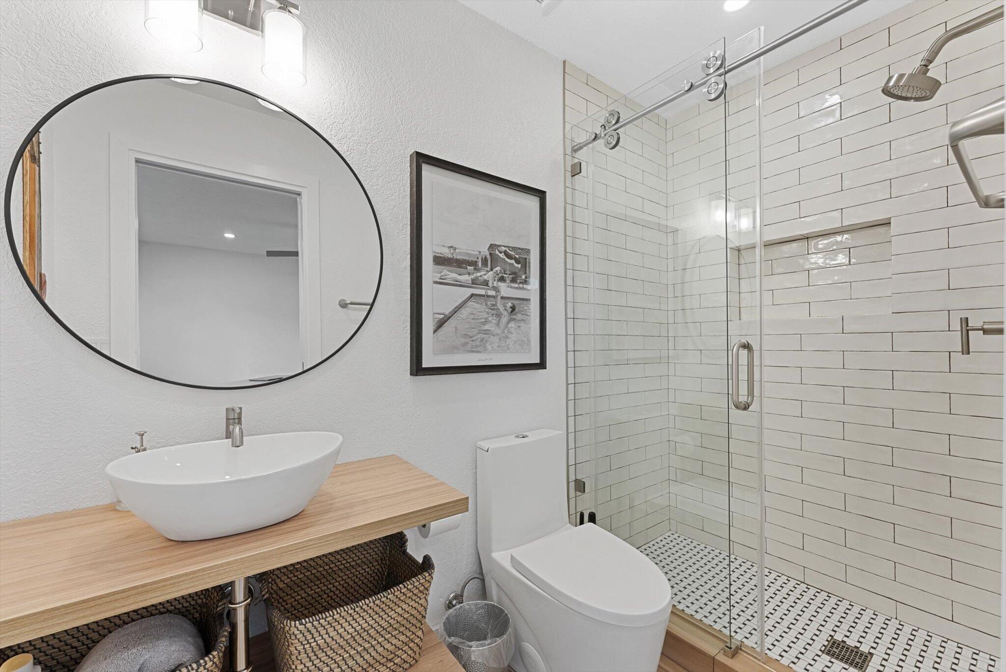 1289 Southwest 7th Street Boca Raton, FL 33486 - Photo 27 of 42 a bathroom with a sink a toilet and shower