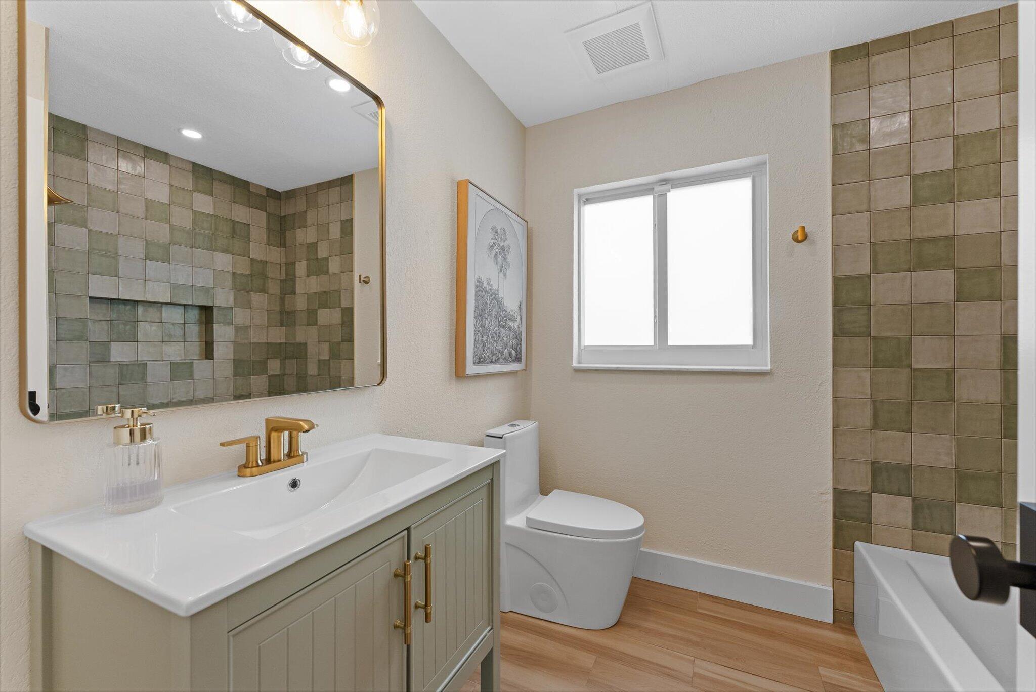 1289 Southwest 7th Street Boca Raton, FL 33486 - Photo 29 of 42 a bathroom with a sink toilet and shower