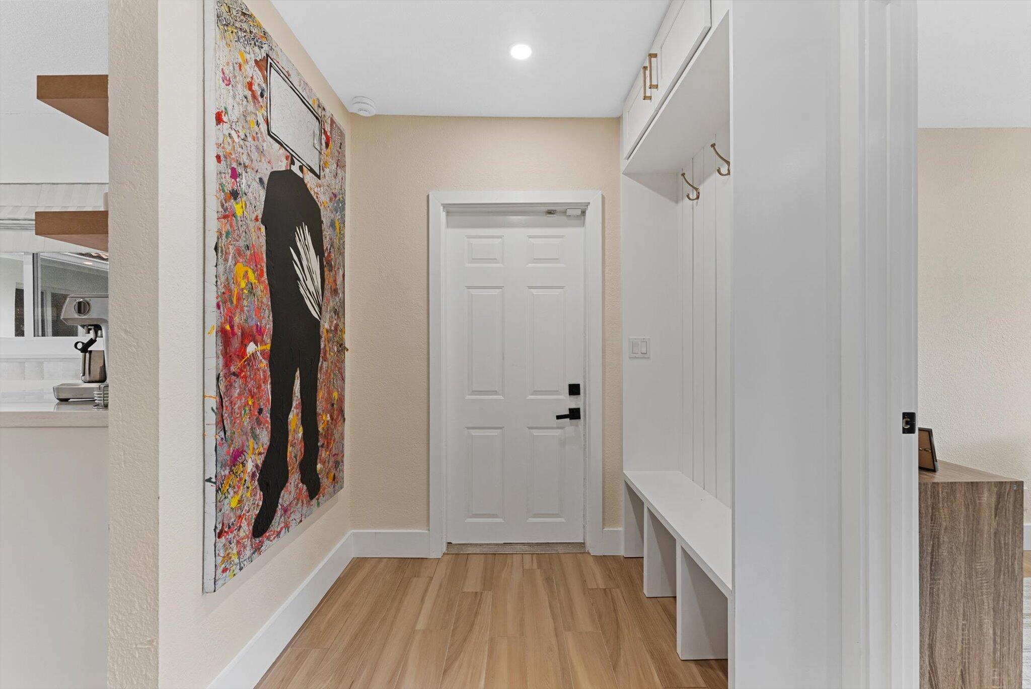1289 Southwest 7th Street Boca Raton, FL 33486 - Photo 33 of 42 a view of a hallway with wooden floor and closet