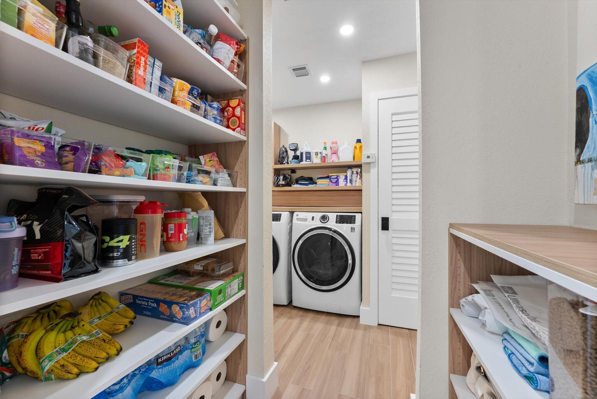 1289 Southwest 7th Street Boca Raton, FL 33486 - Photo 34 of 42 a utility room with lots of clutter and cabinets
