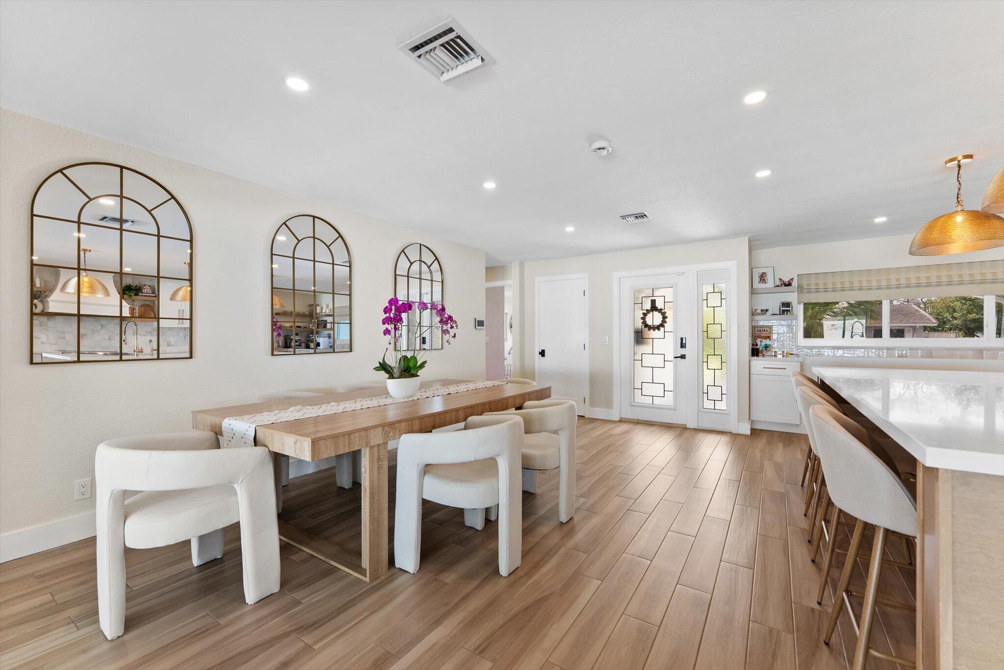 1289 Southwest 7th Street Boca Raton, FL 33486 - Photo 4 of 42 a view of a kitchen with furniture and wooden floor