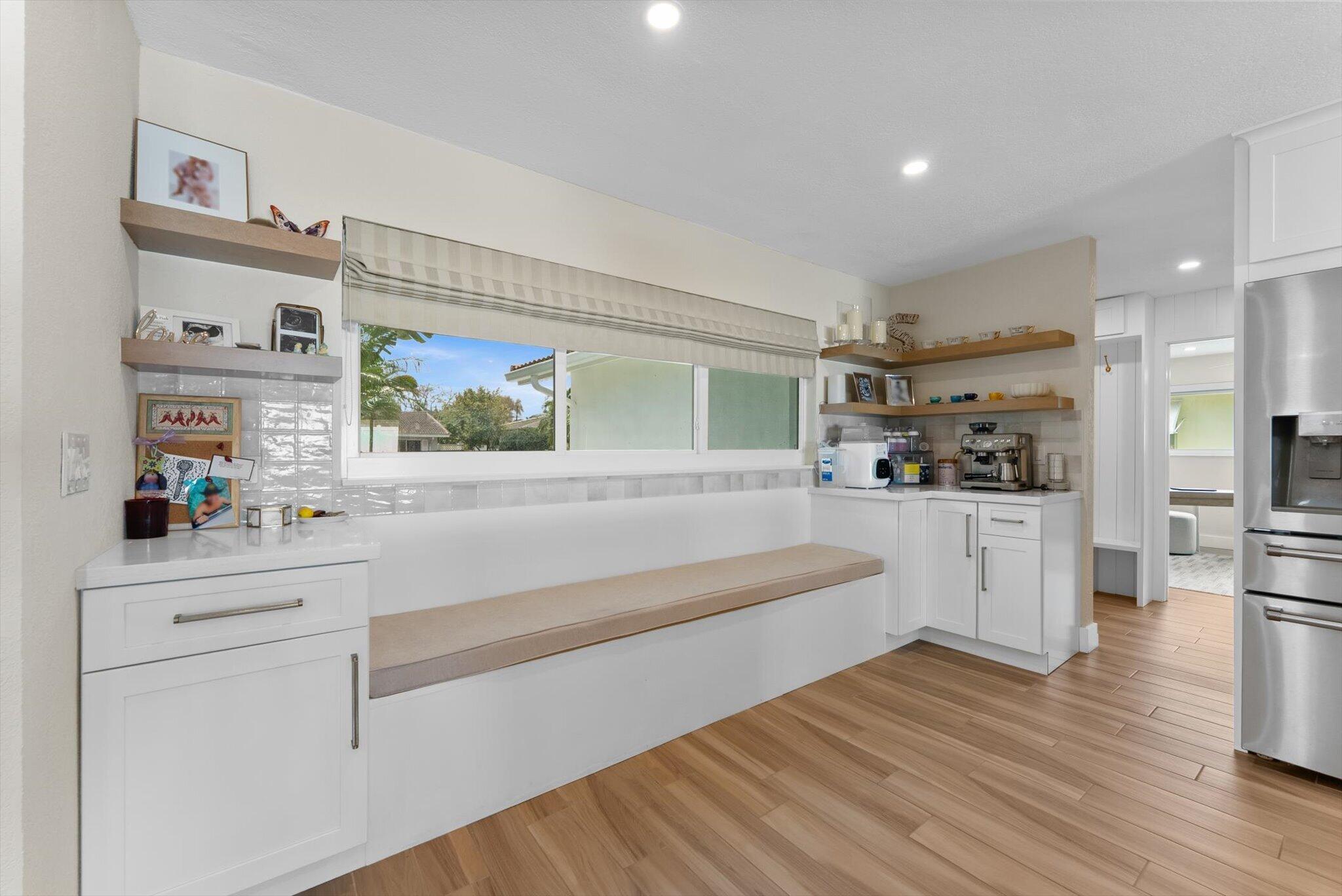 1289 Southwest 7th Street Boca Raton, FL 33486 - Photo 5 of 42 a kitchen with white cabinets and counter space