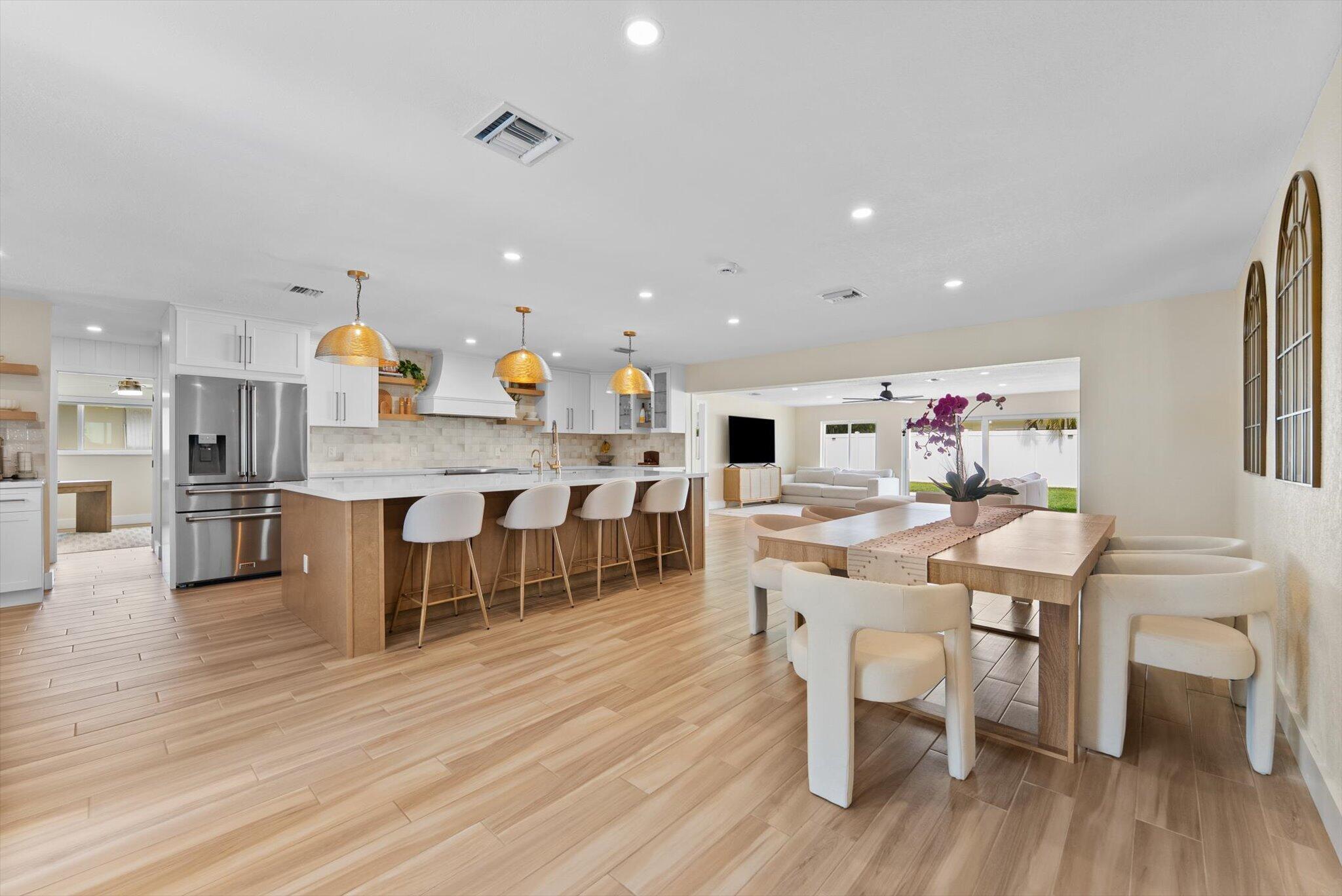 1289 Southwest 7th Street Boca Raton, FL 33486 - Photo 6 of 42 a large kitchen with a table and chairs in it