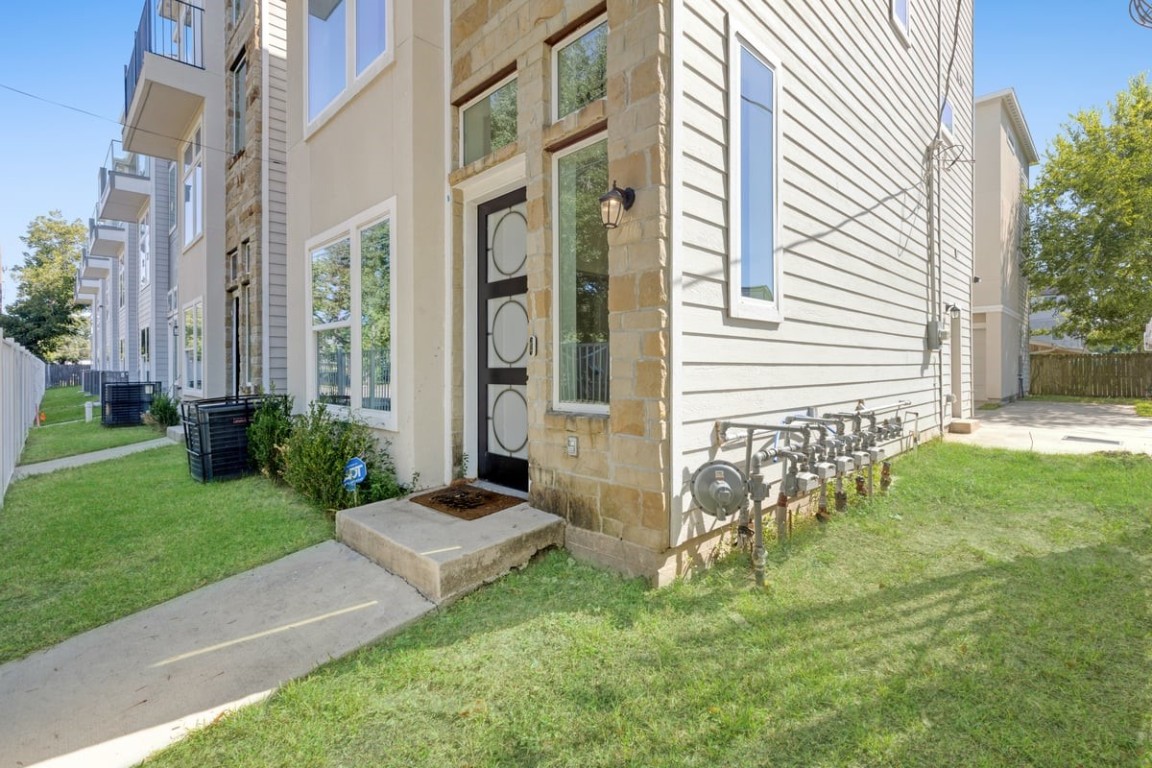 a view of a front of a house with a yard