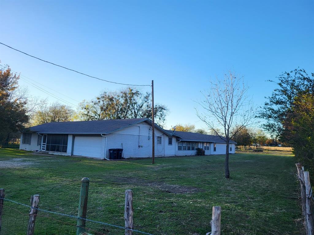 143 County Road 1307 Morgan, TX 76671 - Photo 2 of 8 a view of a house with a yard