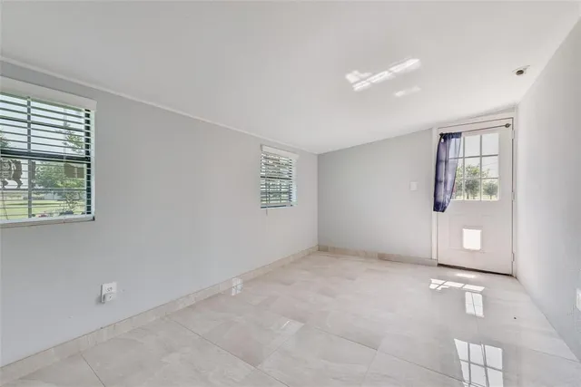 an empty room with windows