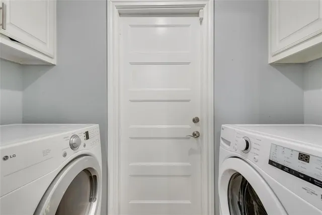 a view of washer and dryer in a utility room
