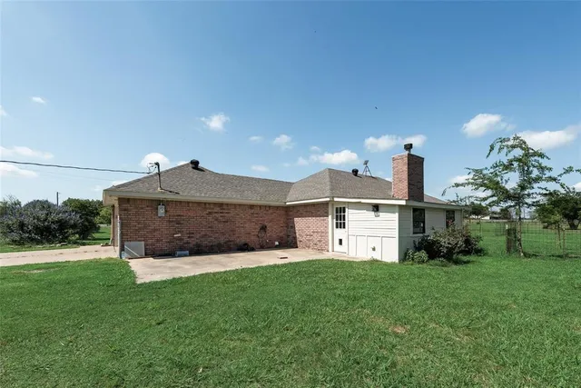 a view of backyard with green space