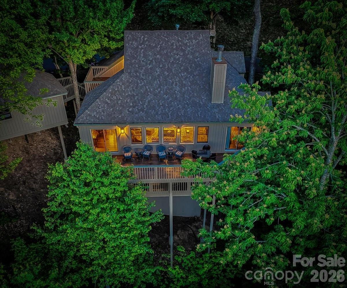121 Ivy Ridge Road Burnsville, NC 28714 - Photo 47 of 48 an aerial view of a house with a yard and large trees