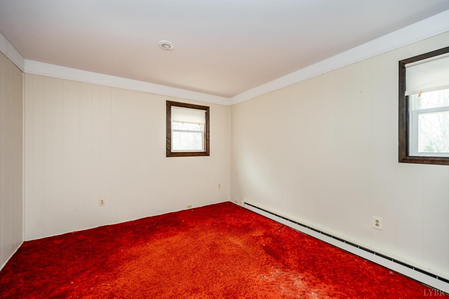 182 Buffalo Ridge Road Amherst, VA 24521 - Photo 20 of 57 an empty room with windows