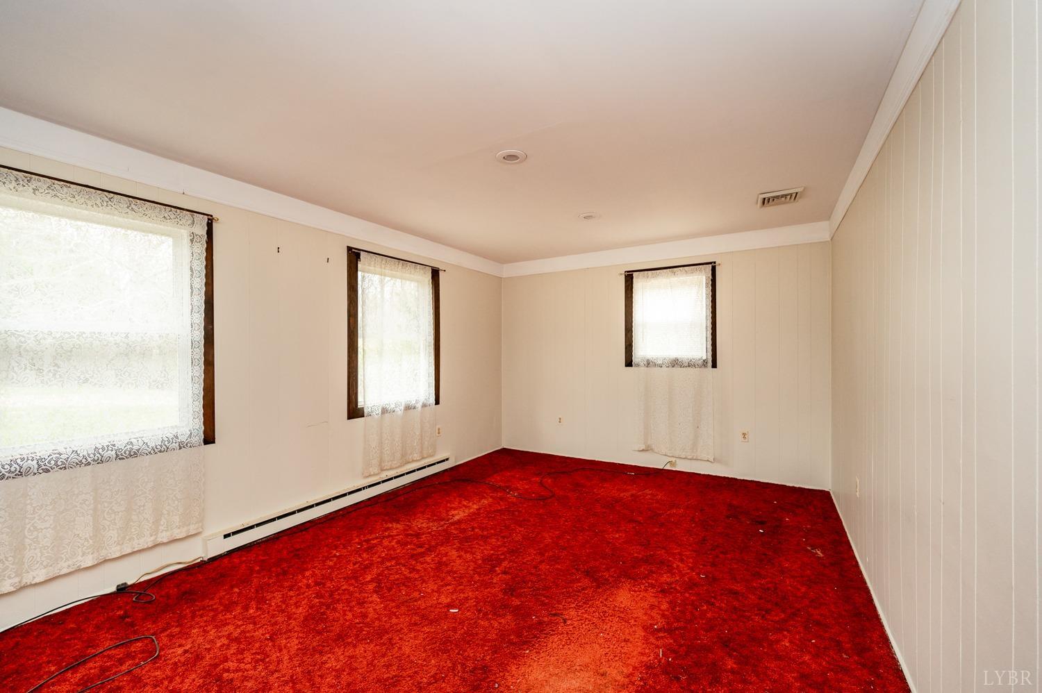 182 Buffalo Ridge Road Amherst, VA 24521 - Photo 22 of 57 an empty room with windows
