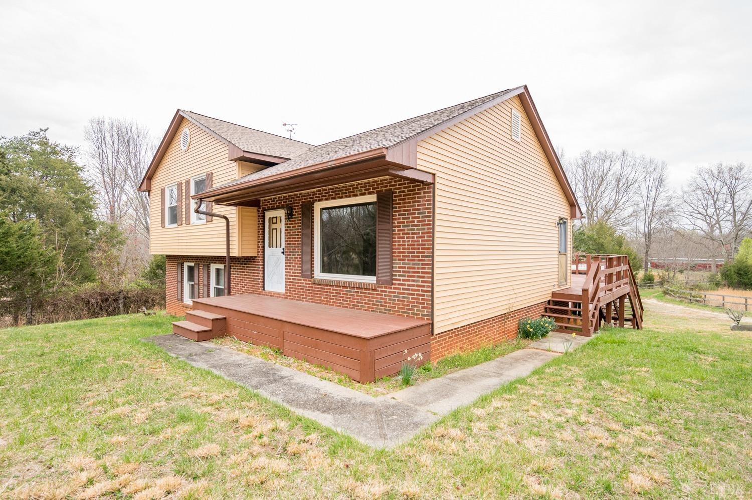 182 Buffalo Ridge Road Amherst, VA 24521 - Photo 26 of 57 a view of a house with a yard and sitting area