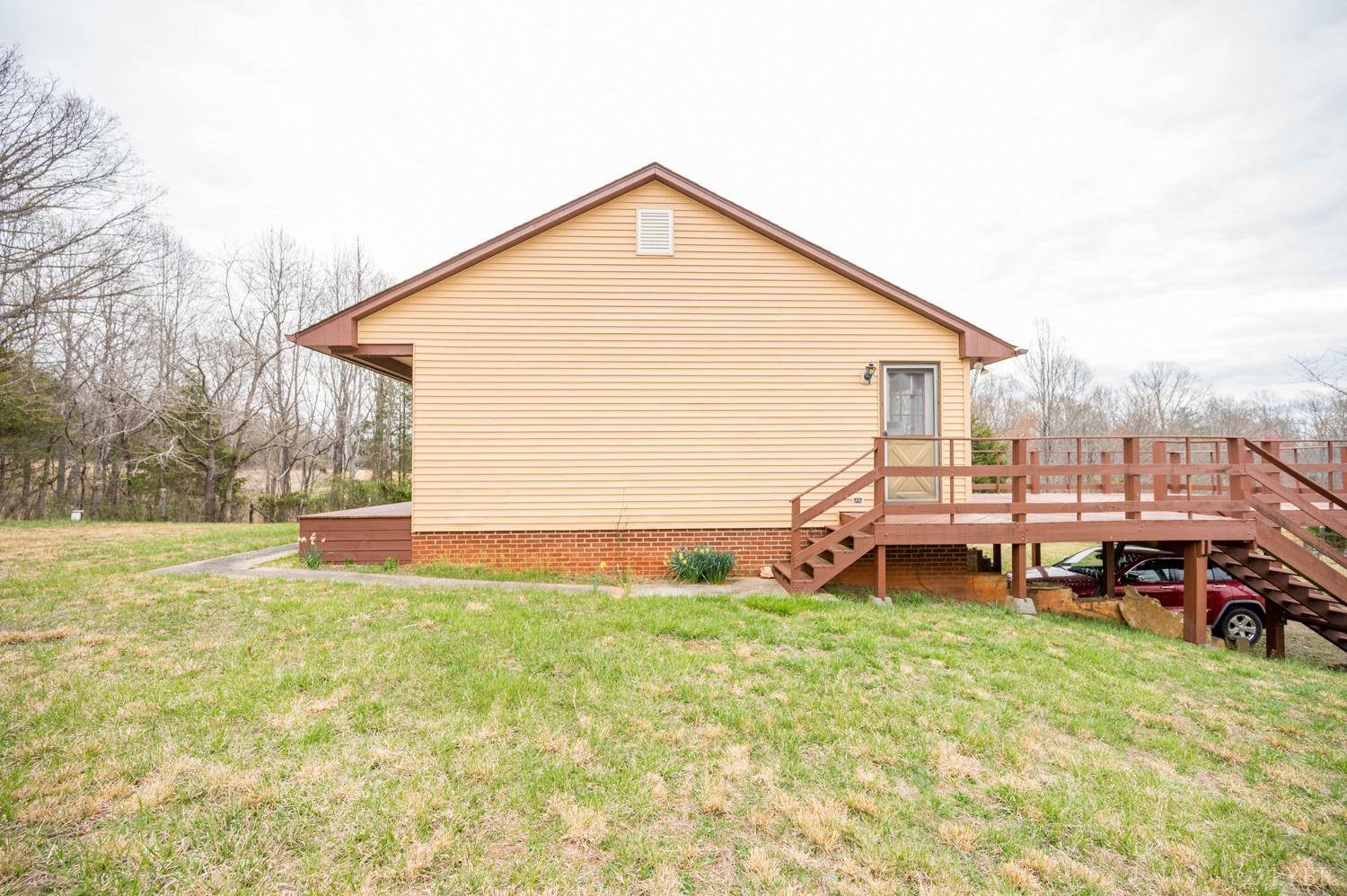 182 Buffalo Ridge Road Amherst, VA 24521 - Photo 27 of 57 a view of a house with a yard and sitting area