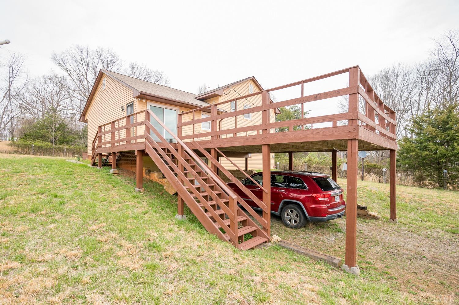 182 Buffalo Ridge Road Amherst, VA 24521 - Photo 28 of 57 a blue and white and a car parked in front of a house