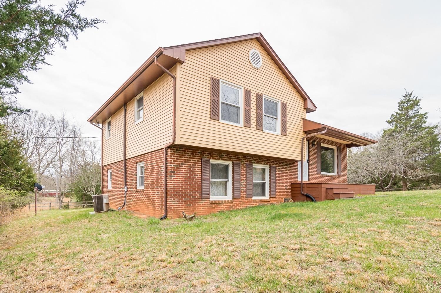 182 Buffalo Ridge Road Amherst, VA 24521 - Photo 32 of 57 a front view of a house with a yard
