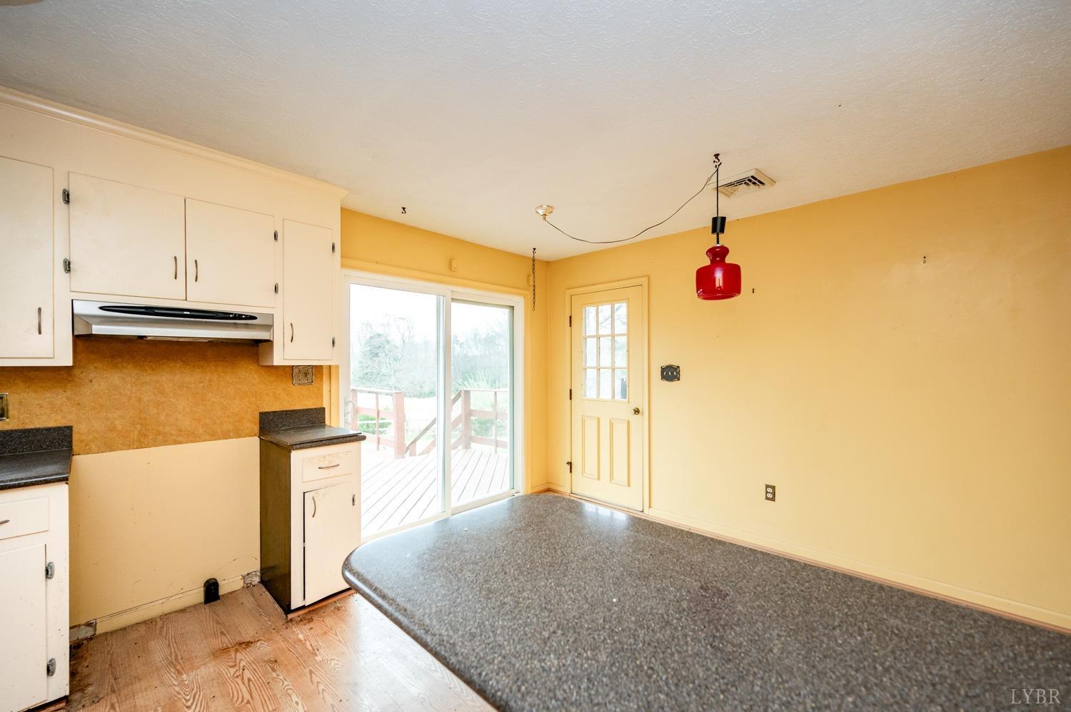 182 Buffalo Ridge Road Amherst, VA 24521 - Photo 8 of 57 a view of a kitchen with wooden floor