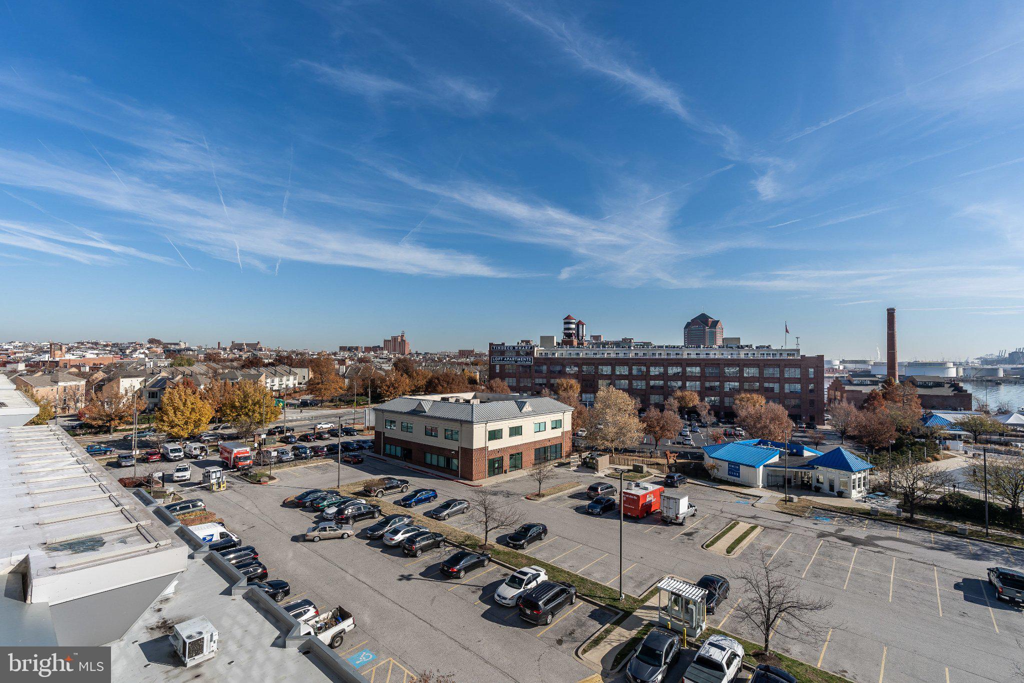 2702 Lighthouse Point East, Unit 532 Baltimore, MD 21224 - Photo 33 of 41 Urban skyline with vibrant autumn hues.