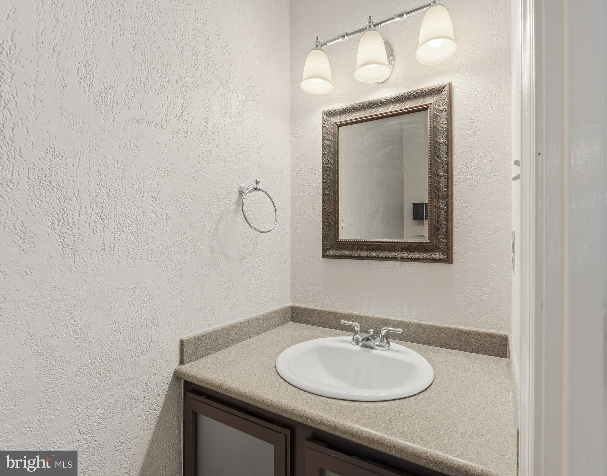 6036 Old Landing Way, Unit 29 Burke, VA 22015 - Photo 12 of 31 a bathroom with a sink and a mirror