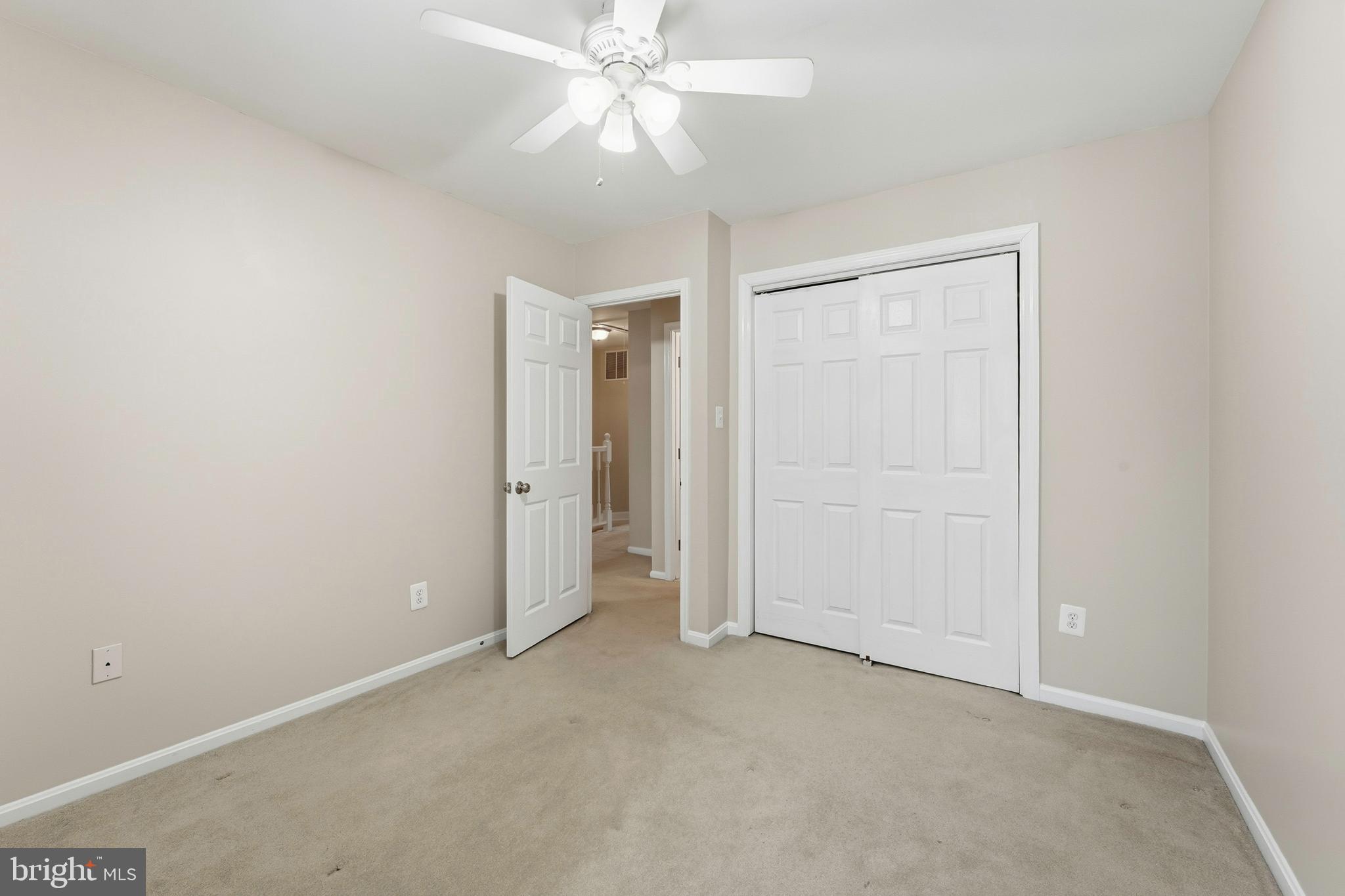 6036 Old Landing Way, Unit 29 Burke, VA 22015 - Photo 18 of 31 an empty room with a ceiling fan and a window