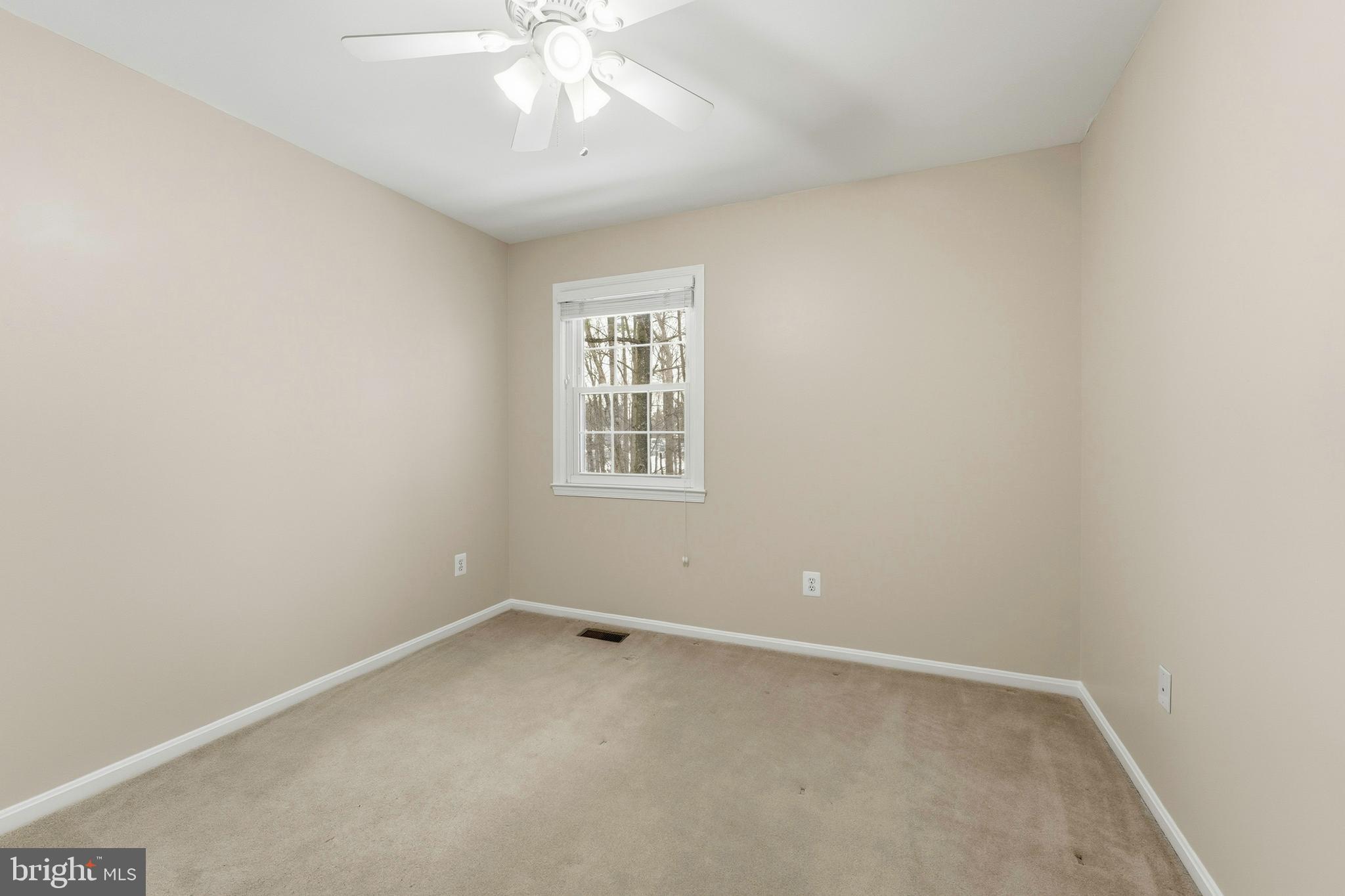 6036 Old Landing Way, Unit 29 Burke, VA 22015 - Photo 19 of 31 an empty room with a chandelier fan