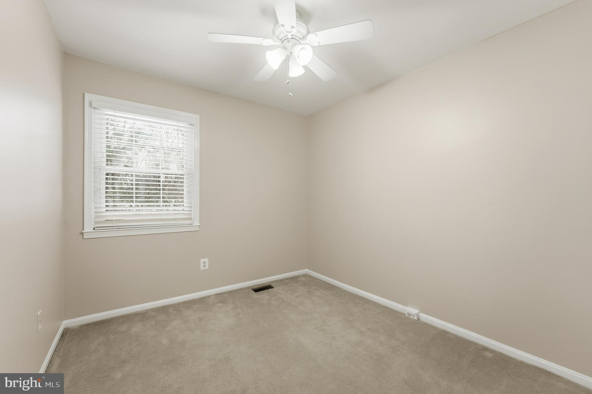 6036 Old Landing Way, Unit 29 Burke, VA 22015 - Photo 22 of 31 an empty room with a window and a fan