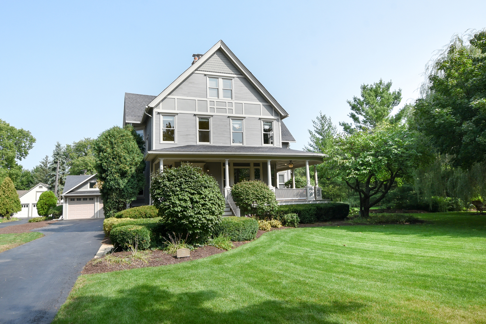 300 North Delaplaine Road Riverside, IL 60546 - Photo 2 of 50 a aerial view of a house with a yard