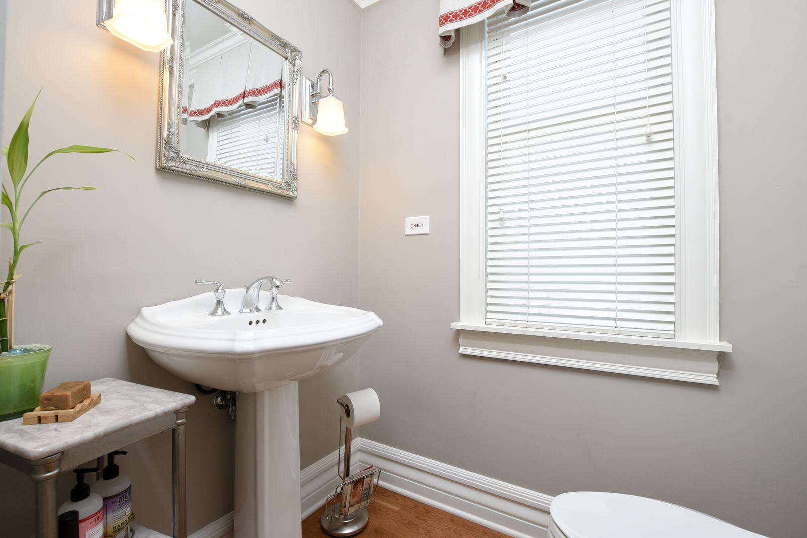 300 North Delaplaine Road Riverside, IL 60546 - Photo 11 of 50 a bathroom with a sink a toilet and a mirror