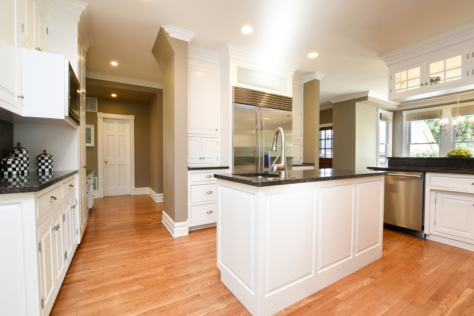 300 North Delaplaine Road Riverside, IL 60546 - Photo 14 of 50 a large kitchen with kitchen island granite countertop a large counter top and stainless steel appliances