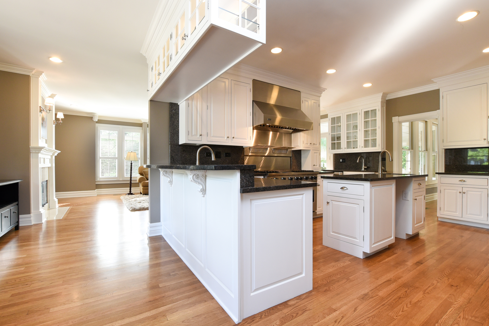 300 North Delaplaine Road Riverside, IL 60546 - Photo 16 of 50 a kitchen with cabinets and wooden floor