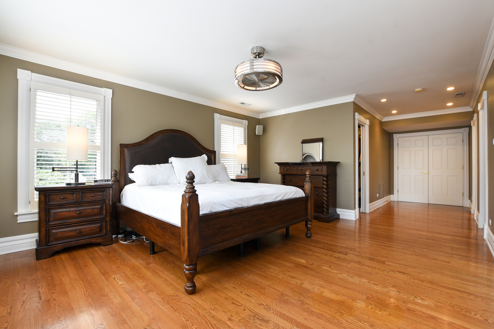 300 North Delaplaine Road Riverside, IL 60546 - Photo 25 of 50 a bedroom with a bed and wooden floor