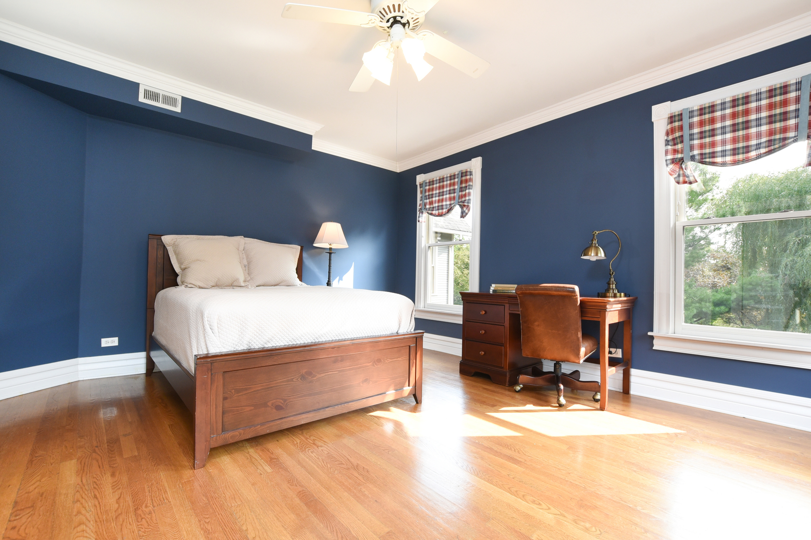 300 North Delaplaine Road Riverside, IL 60546 - Photo 31 of 50 a bedroom with a bed and wooden floor