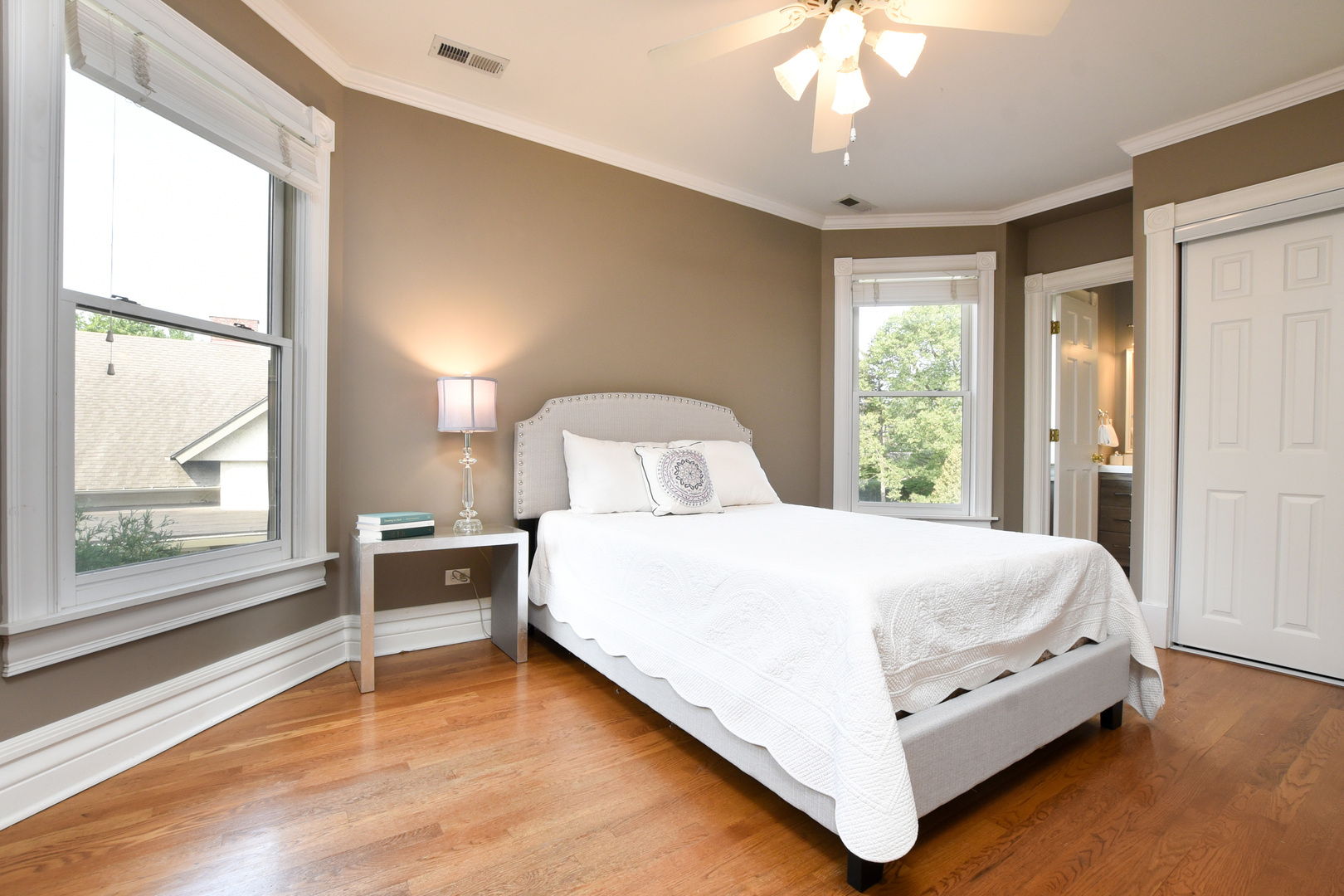 300 North Delaplaine Road Riverside, IL 60546 - Photo 32 of 50 a bedroom with a bed and a large window with outer view
