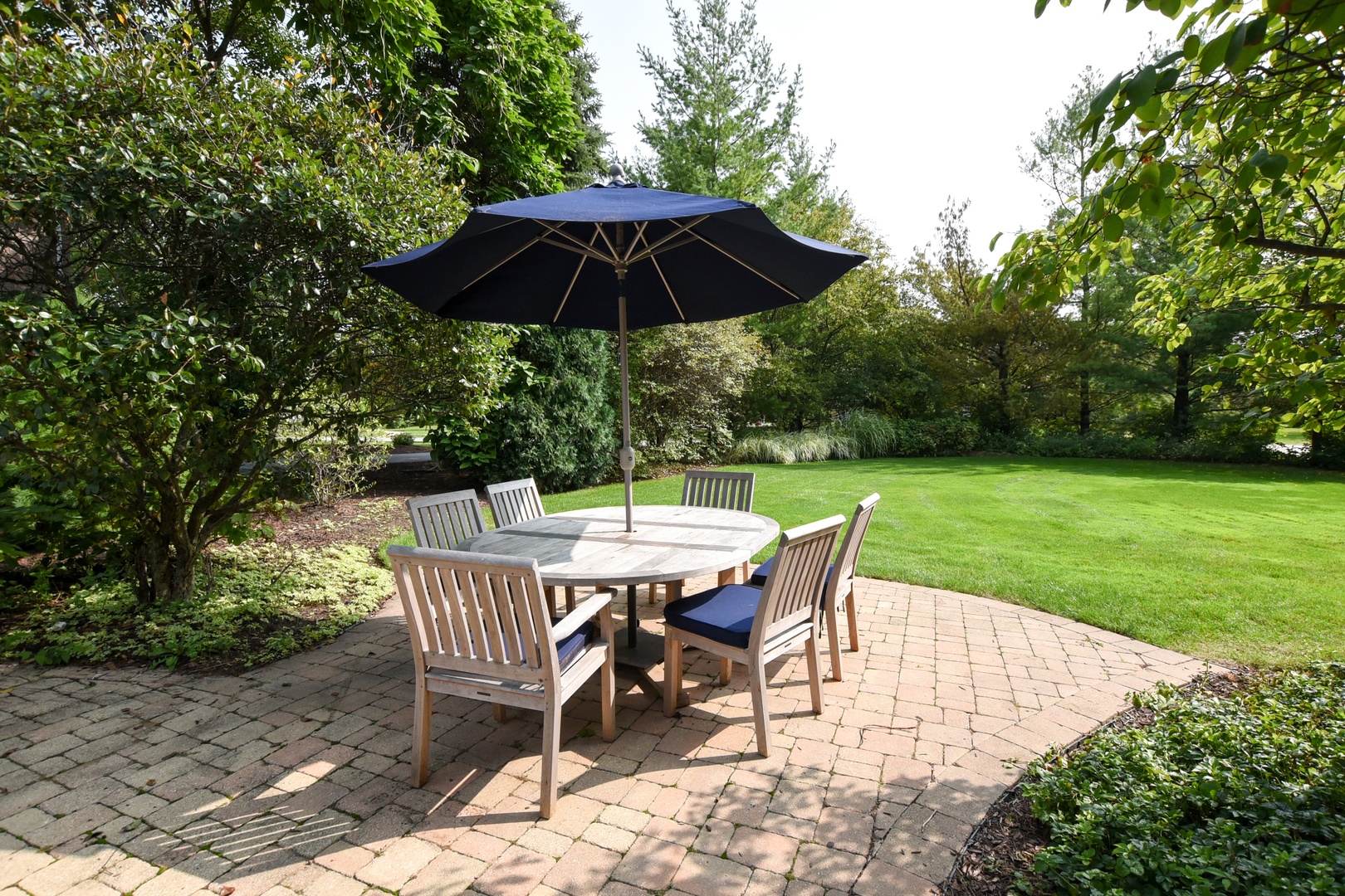 300 North Delaplaine Road Riverside, IL 60546 - Photo 48 of 50 a patio with a yard table and chairs