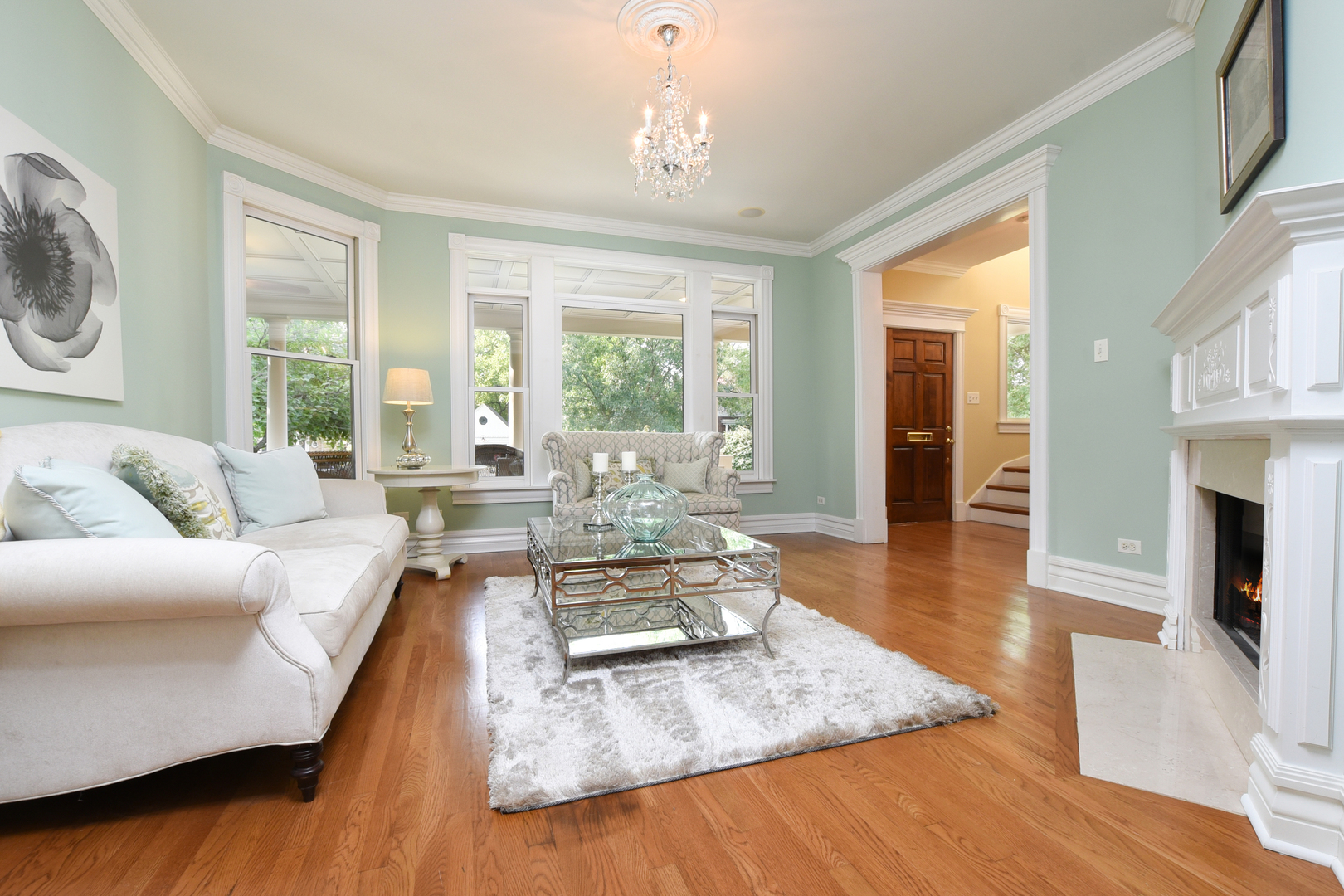 300 North Delaplaine Road Riverside, IL 60546 - Photo 7 of 50 a living room with fireplace furniture and a wooden floor
