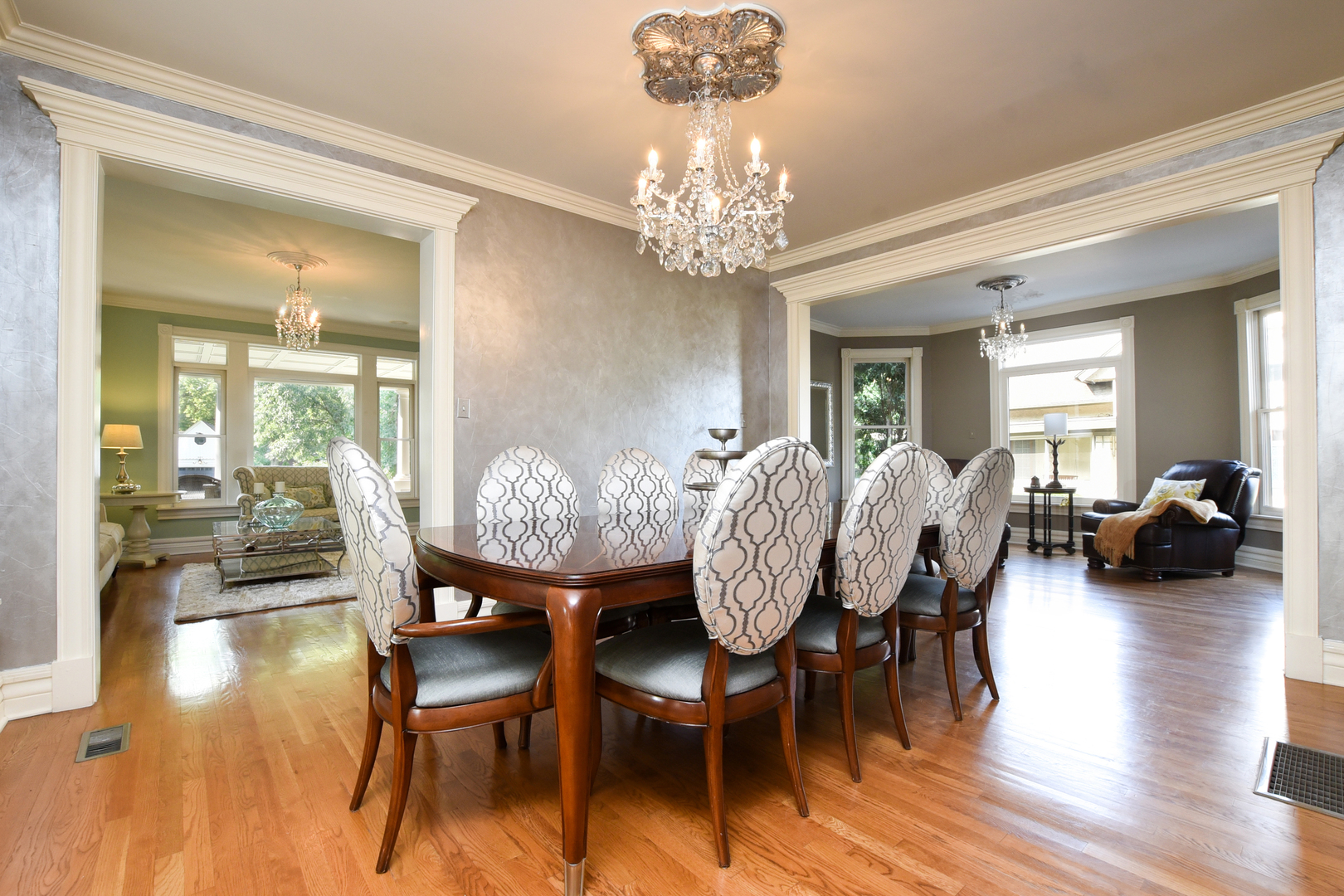 300 North Delaplaine Road Riverside, IL 60546 - Photo 9 of 50 a view of a dining room with furniture wooden floor and chandelier