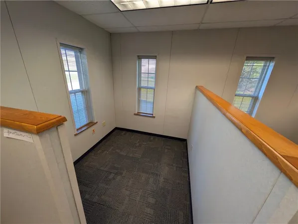 a view of an entryway with wooden floor and door
