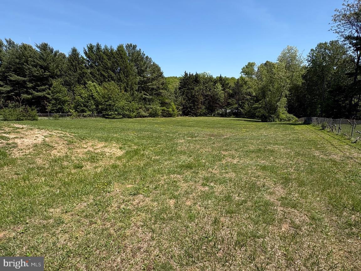 4215 Buffalo Road Mount Airy, MD 21771 - Photo 43 of 44 a view of a field with trees in the background