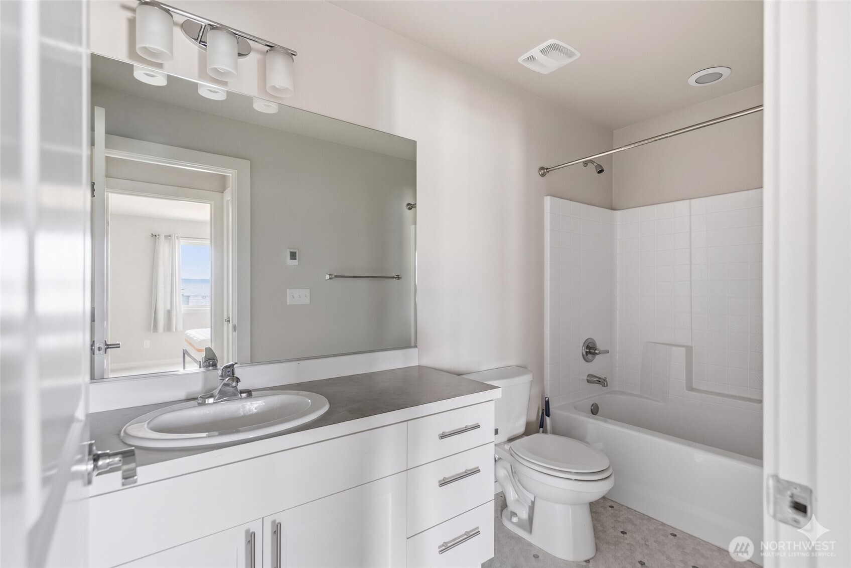 1066 Southwest 99th Place, Unit 55 Seattle, WA 98106 - Photo 9 of 21 a bathroom with a sink toilet vanity and shower
