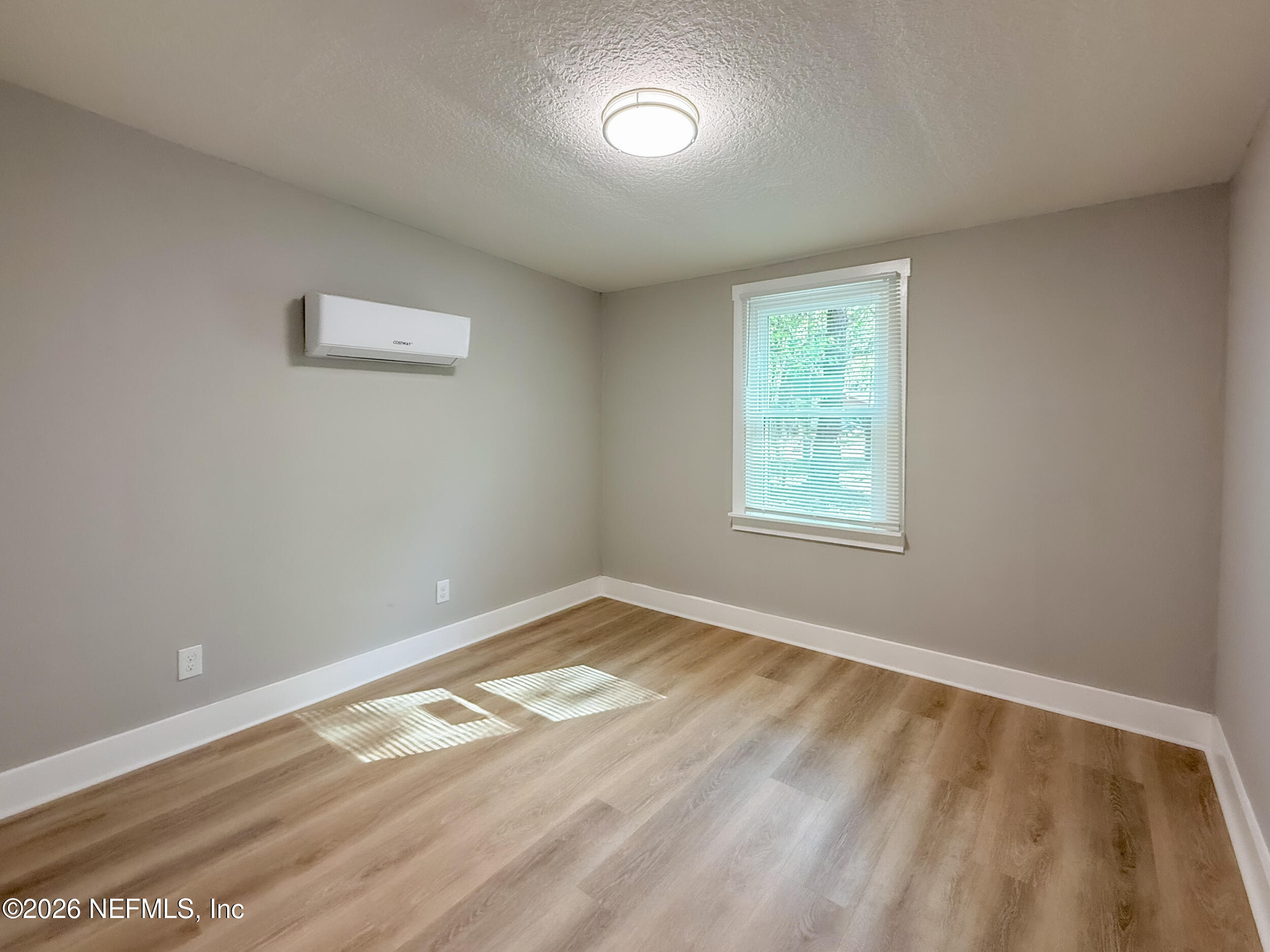 6304 Blanchard Road Jacksonville, FL 32216 - Photo 11 of 15 a view of an empty room with a window