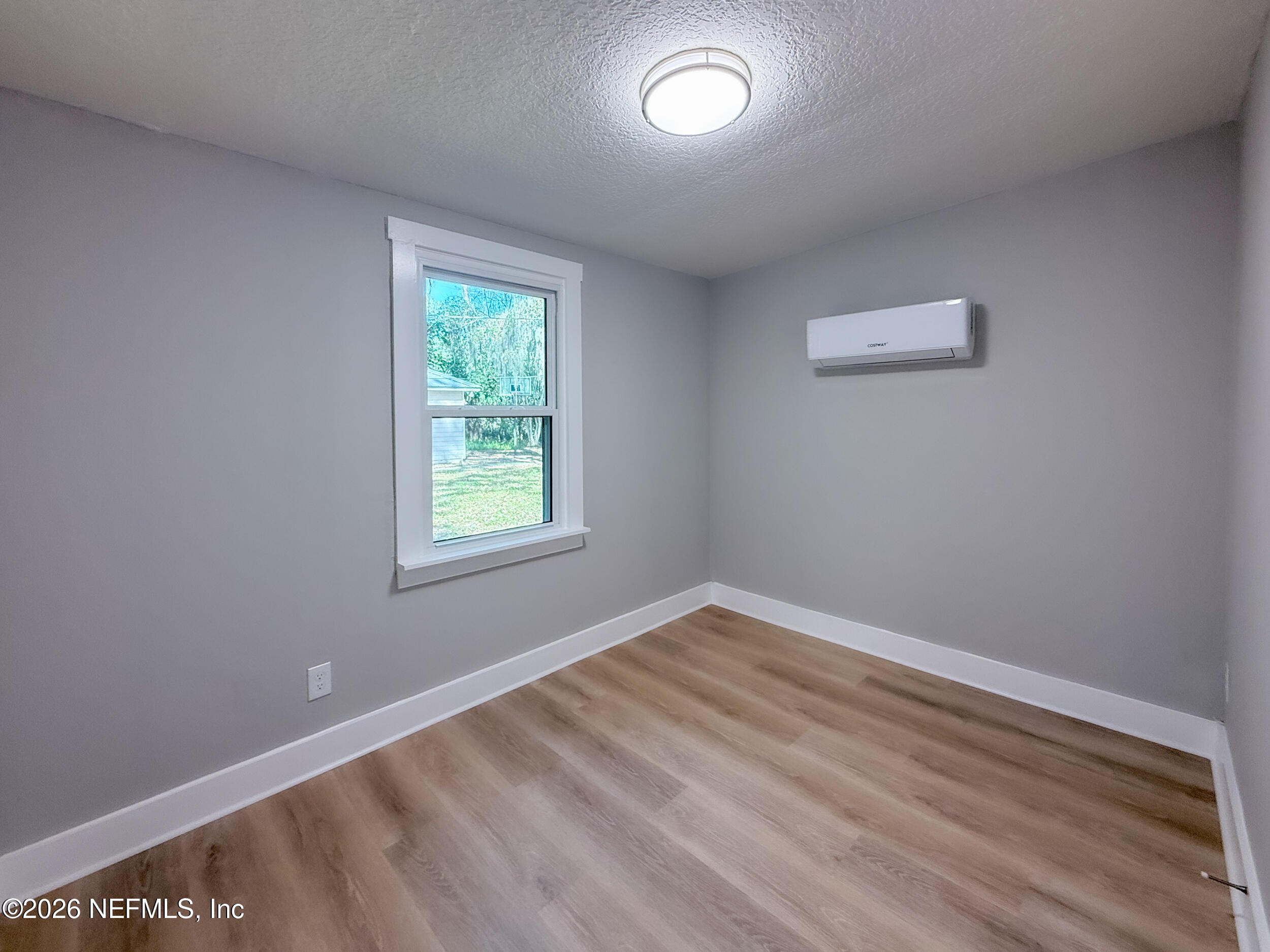 6304 Blanchard Road Jacksonville, FL 32216 - Photo 13 of 15 a view of an empty room with a window