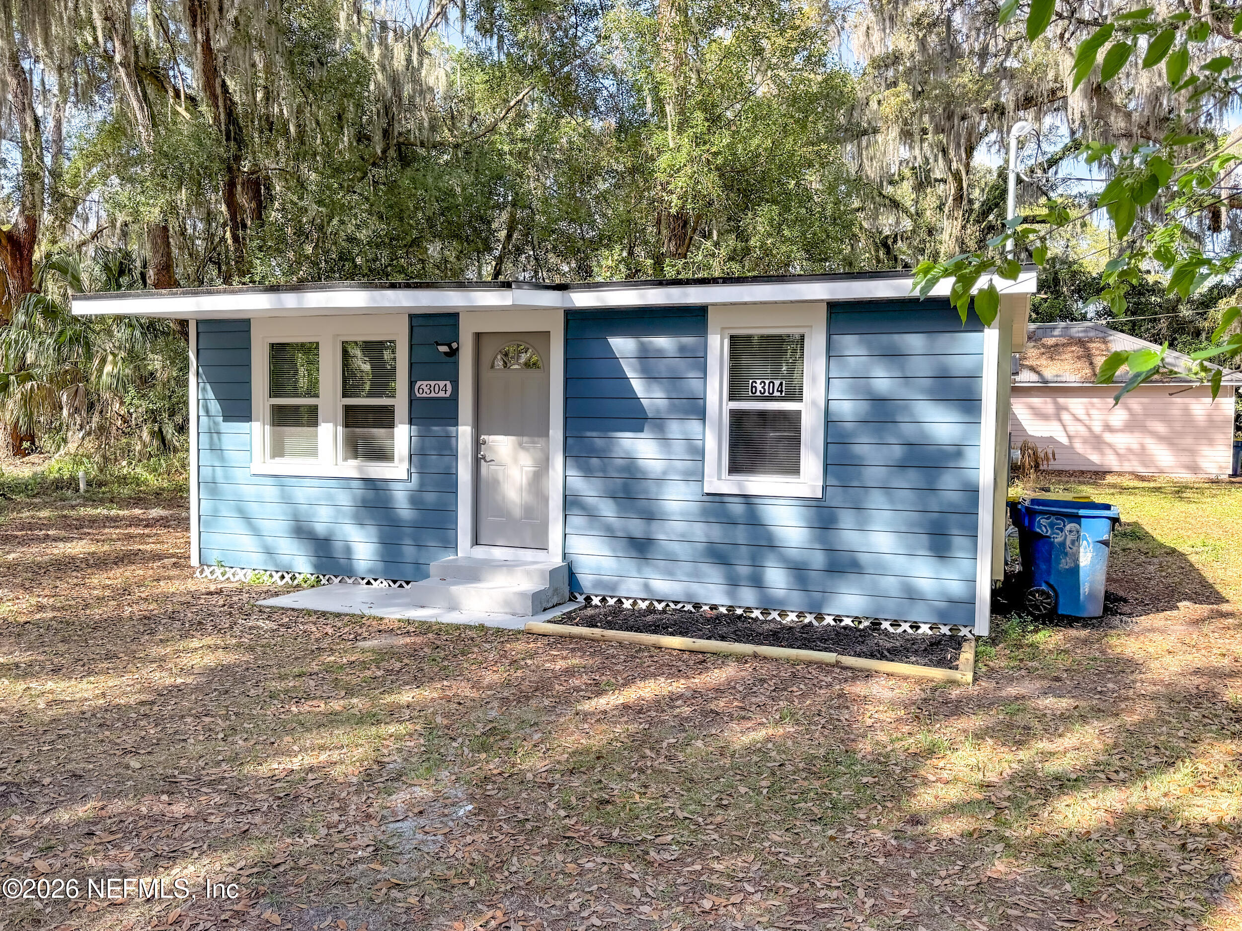 6304 Blanchard Road Jacksonville, FL 32216 - Photo 15 of 15 a view of a house with a yard